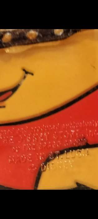 Poo Bear Pin back says  Disney Store St Lucia