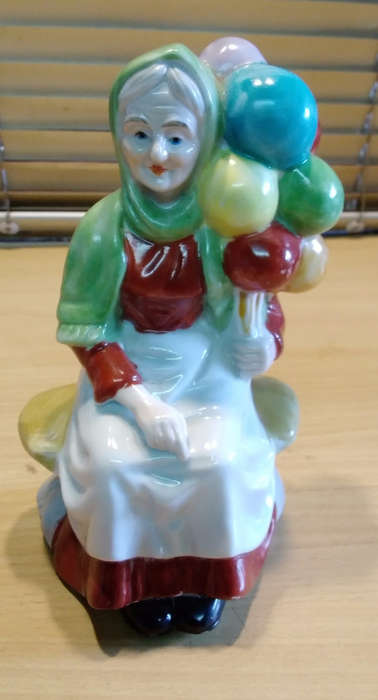Balloon lady figurine