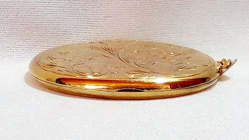 Vintage 9ct gold locket on metal core