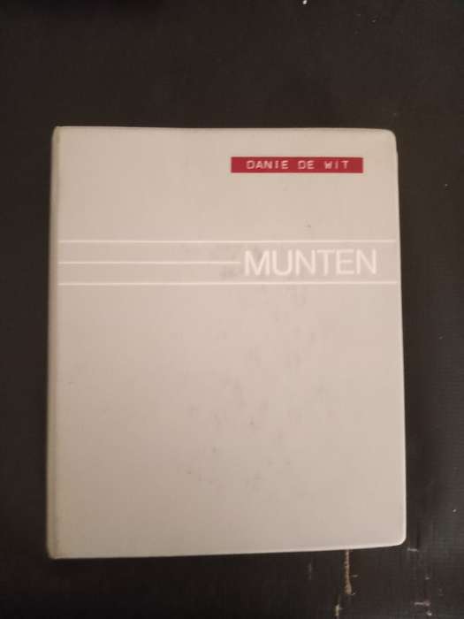 14 Page album filled with over 100 World  coins