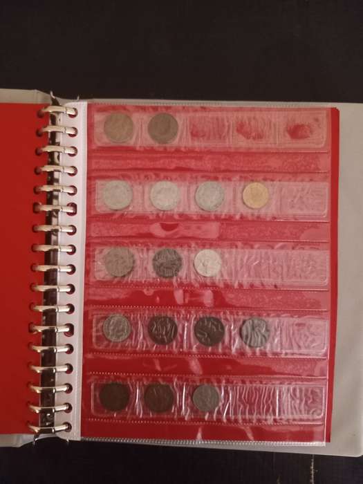 14 Page album filled with over 100 World  coins