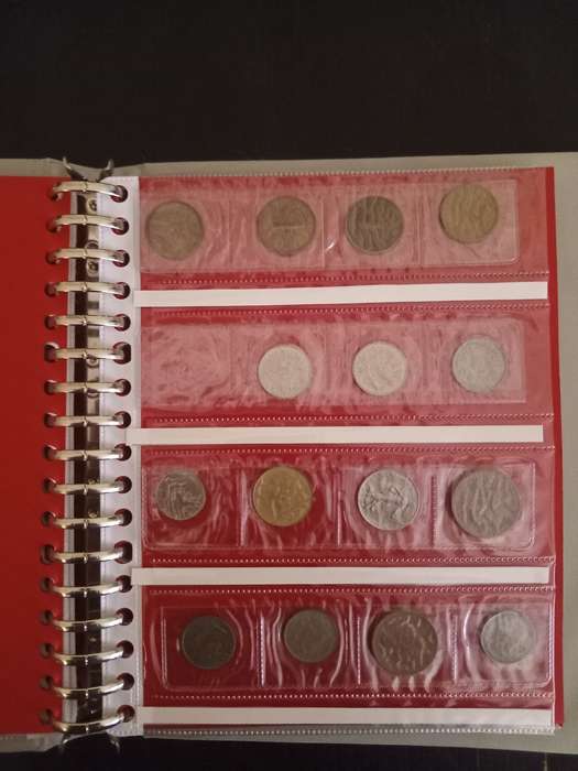 14 Page album filled with over 100 World  coins