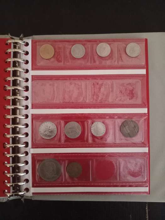 14 Page album filled with over 100 World  coins