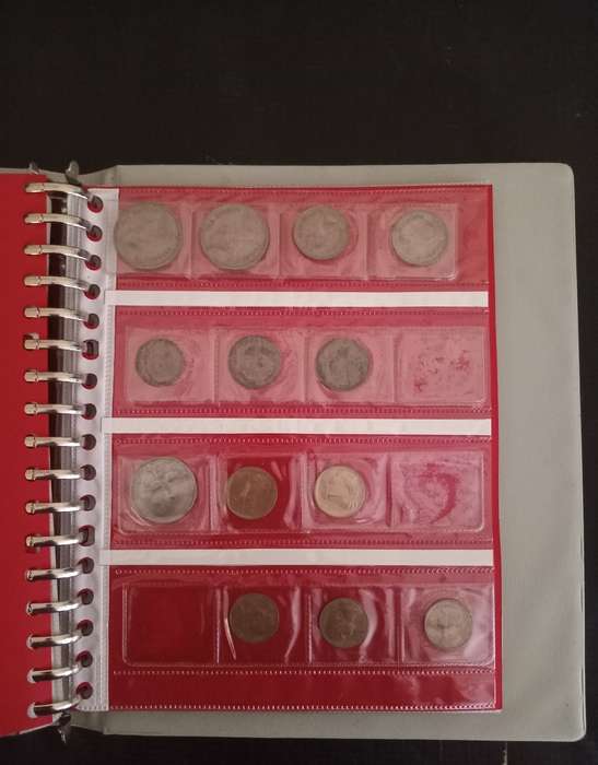 14 Page album filled with over 100 World  coins