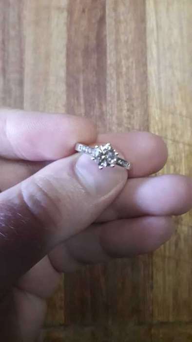 18ct White Gold Solitaire with Channel: Total Diamond weight 1.12ct with 1ct Center stone