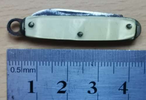 Vintage USA-made mini pocket knife with end ring