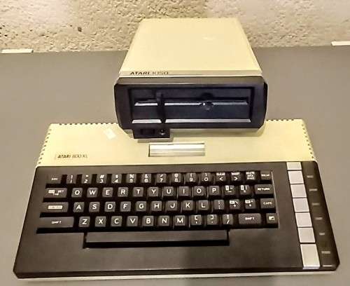 Atari 800 XL Computer and Atari 1050 Floppy Disk Drive with Power Supplies and Cables
