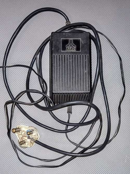 Atari 800 XL Computer and Atari 1050 Floppy Disk Drive with Power Supplies and Cables