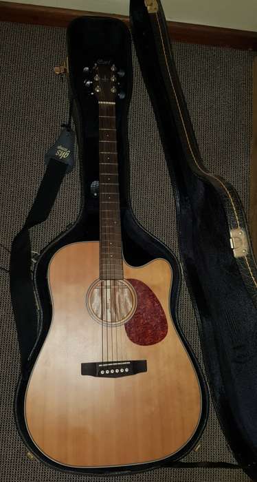 Cort Acoustic steel string Guitar with tuner/pickup and hard carry case