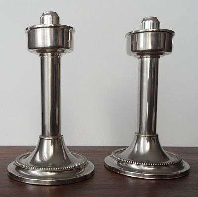 A PAIR OF SPRING LOADED CANDLE HOLDER MARKED BMFN MADE IN W.-GERMANY