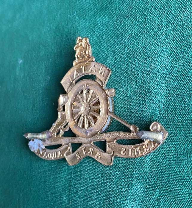 NATAL FIELD ARTILLERY CAP BADGE-ADOPTED IN 1967 GILDING METAL-WORN BY OTHER RANKS- 2 LUGS