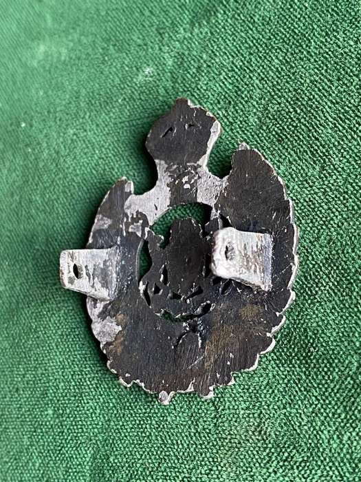 SA ENGINEERS,BLACK CAST CAP BADGE-WORN WW2- 2 LUGS