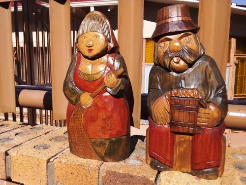Pair of Solid Carved Wooden Figurines