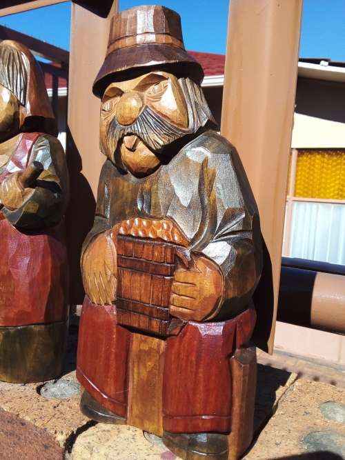 Pair of Solid Carved Wooden Figurines