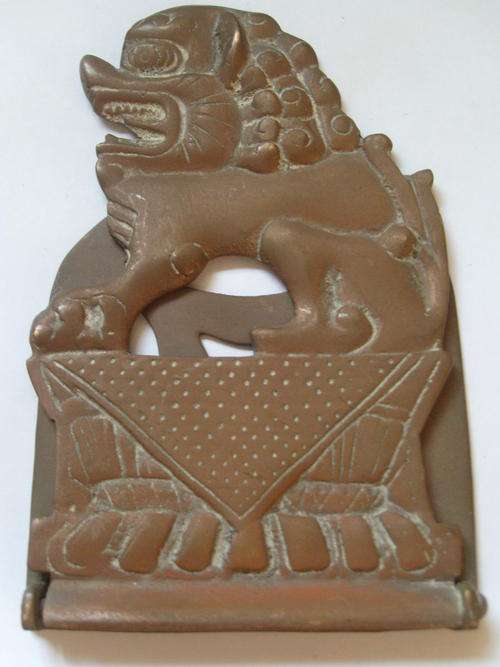 A BRASS HONG KONG FOO DOG BOOK END