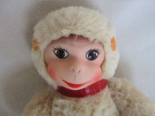 A VINTAGE 1950's/60's FULLY JOINTED MOHAIR RUBBER-FACED SCHUCO MONKEY WITH FELT EARS AND SQUEAKER