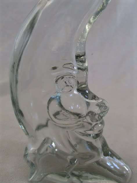 A CUTE CRESCENT MAN-IN-THE-MOON BOTTLE