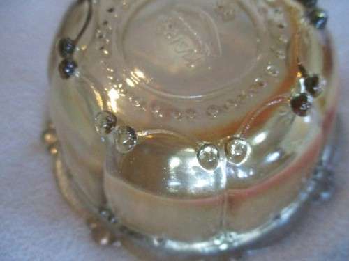 A SET OF SIX IRIDESCENT AMBER GLASS DESSERT BOWLS