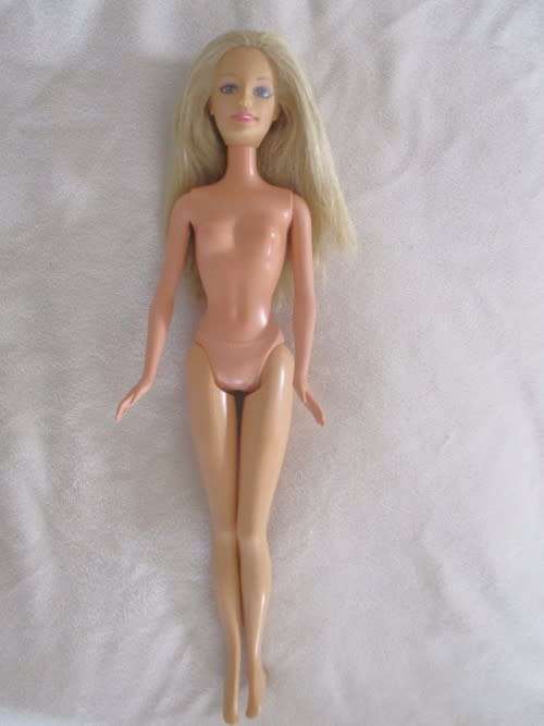 MATTEL BARBIE DOLL IN PJ`S AND GOWN AND WITH KNEES THAT BEND (PLUS EXTRA DRESS)