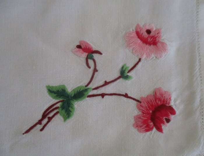 A VINTAGE RECTANGULAR VERY NEATLY HAND EMBROIDERED CLOTH WITH FLORAL DESIGN
