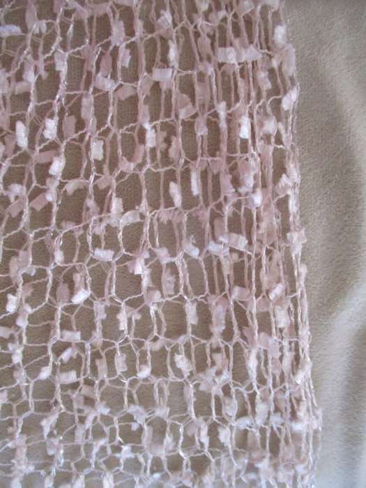 A DELICATE, FEMININE POWDER PINK SHAWL WITH LONG TASSELS AND SILVER STRANDS