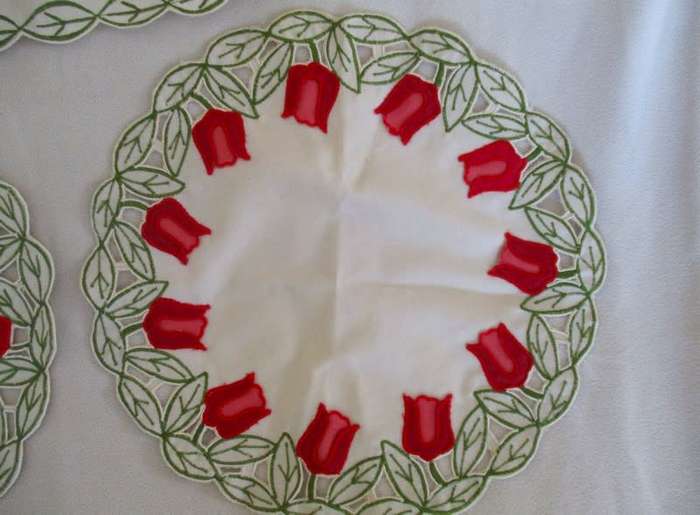 A set of five cloths - appliqued and embroidered with pretty Dutch tulips
