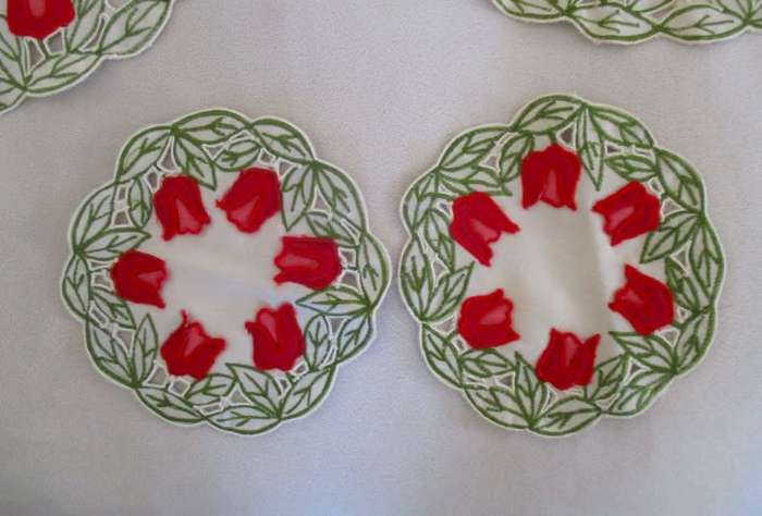 A set of five cloths - appliqued and embroidered with pretty Dutch tulips