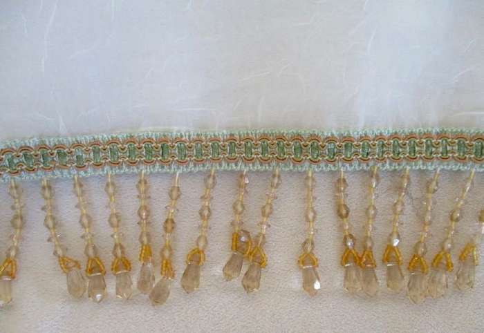 A stunning large, gossamer cloth with pretty beaded tassels