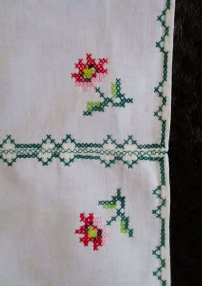 Rather different - an embroidered cross stitch runner with pretty roses