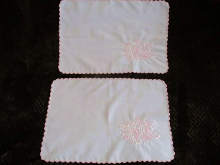Two pretty white cloths embroidered with pink flowers