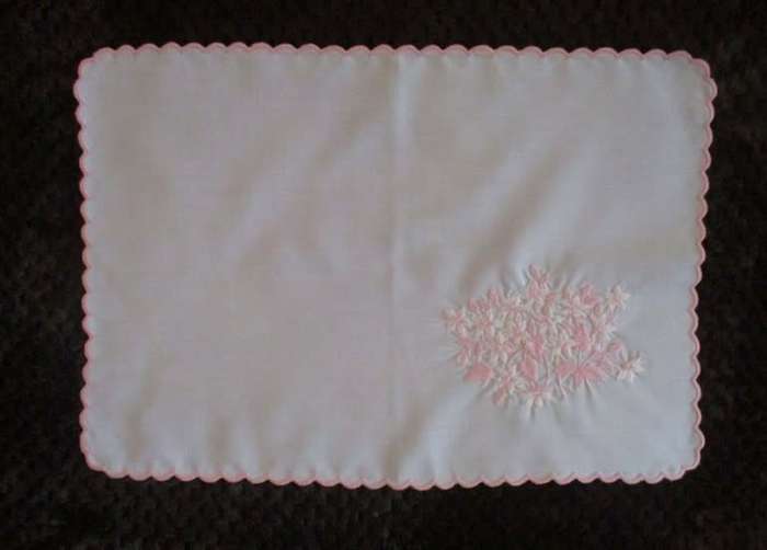 Two pretty white cloths embroidered with pink flowers