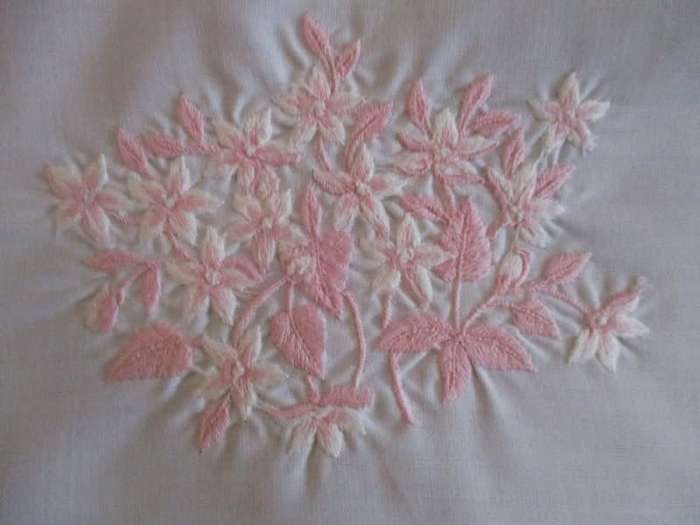 Two pretty white cloths embroidered with pink flowers