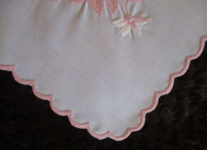 Two pretty white cloths embroidered with pink flowers