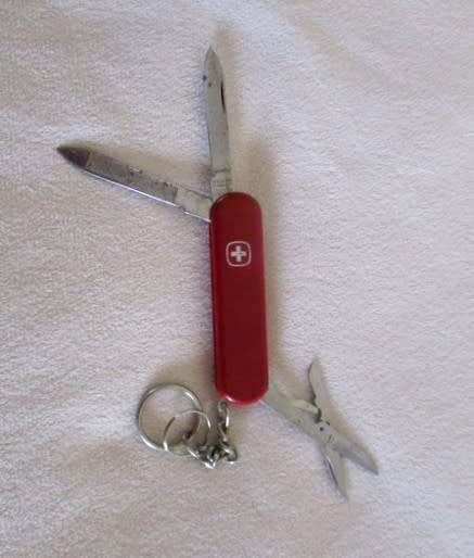 Three small vintage Victorinox Swiss Army Knives