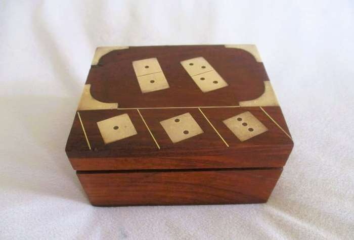 A very well made solid wood and brass domino set with four wooden die
