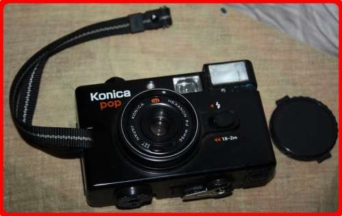 VINTAGE KONICA POP CAMERA WITH CASE AND LENSE COVER  SOLD AS IS