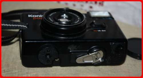 VINTAGE KONICA POP CAMERA WITH CASE AND LENSE COVER  SOLD AS IS