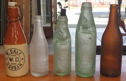 COLLECTION OF FIVE VINTAGE BOTTLE'S