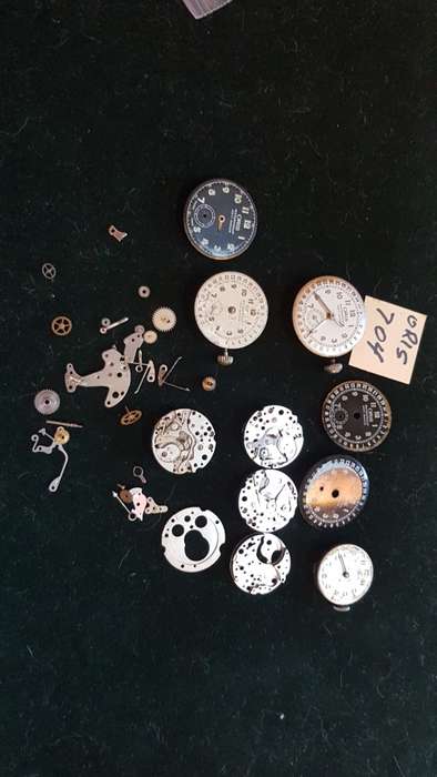 Lot of Oris 704 watch movements and spares.