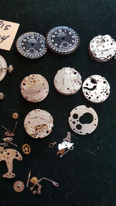 Lot of Oris 704 watch movements and spares.