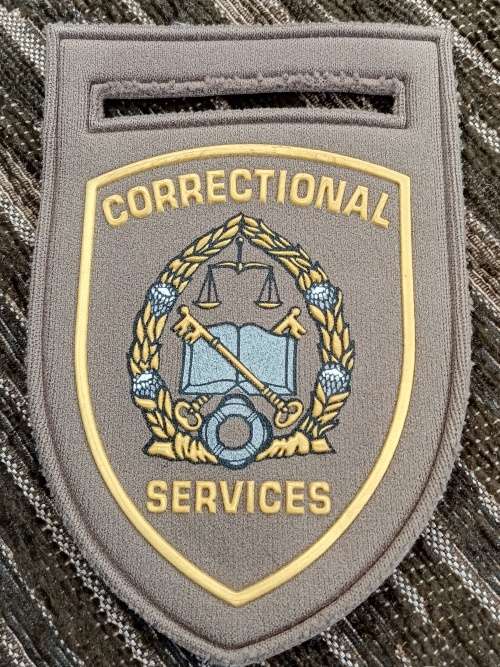Correctional services tupper badges