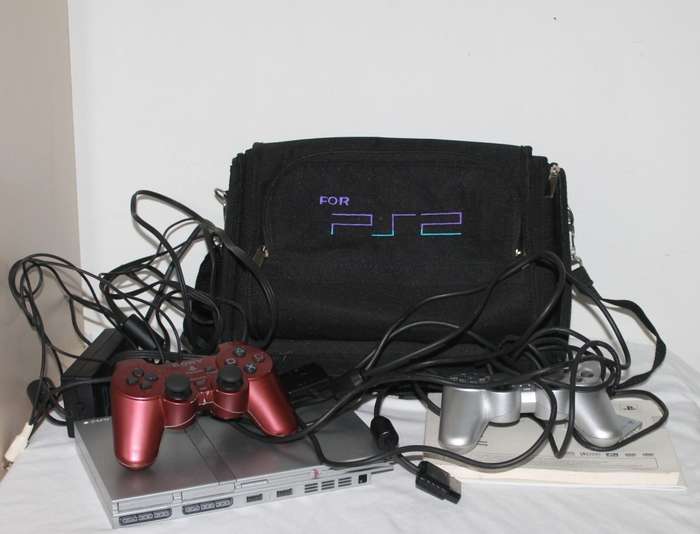 PlayStation 2  with 2 Controller`s, Memory Card, bag and manual