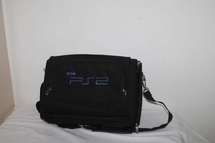 PlayStation 2  with 2 Controller`s, Memory Card, bag and manual