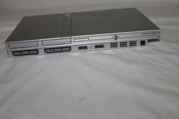PlayStation 2  with 2 Controller`s, Memory Card, bag and manual