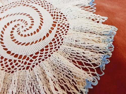 Frilly doily/ doilie with blue edge- acrylic - 23cm