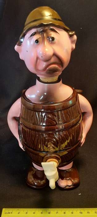 Decanter Man in Barrel with four small mugs on his Back