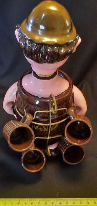 Decanter Man in Barrel with four small mugs on his Back