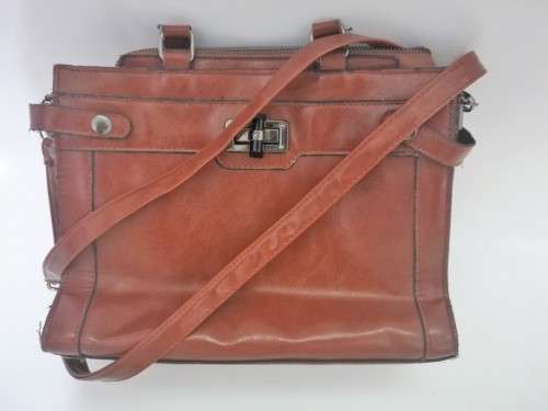 Brown handbag with handles and shoulder strap