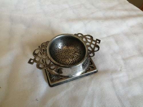 Art Nouveau 2 piece EPNS tea strainer