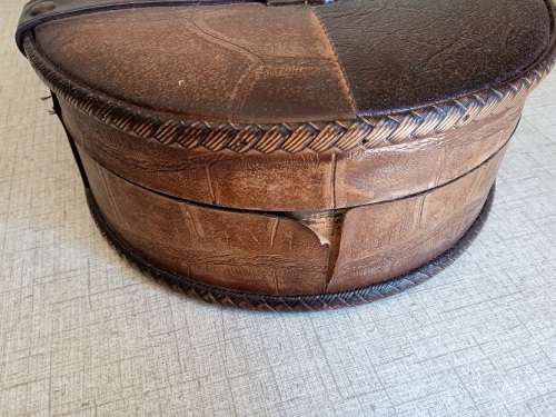 Small wooden suitcase, covered in leather
